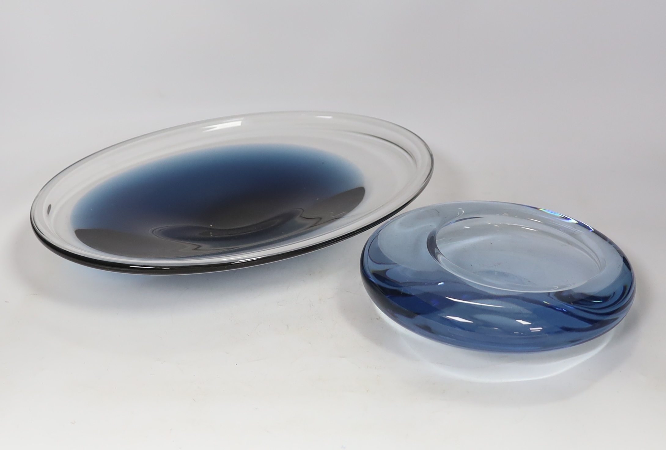 Two 1960's glass dishes, a Per Lutken for Holmegaard example and a Wedgwood example, both signed, largest 33.5cm